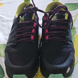 Black Athletic Sneakers with Pink Accents and Mint Soles
